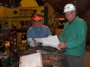 Kevin Lhota, (right), Production & Maintenance Senior Leader at the ATI Allegheny Ludlum steel plant and Tom Polczynski (left) of Winkle Industries review drawings for the next project. 