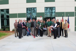 Constantino Lannes, President of SENNEBOGEN LLC and the team cut the ribbon to open the newly expanded facility in Charlotte, North Carolina. “This facility represents a commitment to our marketplace.”