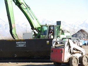 From his vantage point, the operator has a clear view of the side of the bin. 