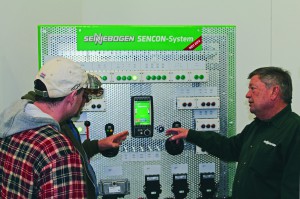 Chief Trainer, Roger Hardin reviews the SENNEBOGEN SENNCON-System with a couple of technicians. 