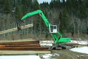 The custom elevated cab on the Stella-Jones machines help operators to load efficiently without damaging poles. 