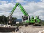 The SENNEBOGEN 821 electric material handler efficiently and quietly sorts and loads materials at the Remo Recycling AG facility in Brienne, Switzerland.